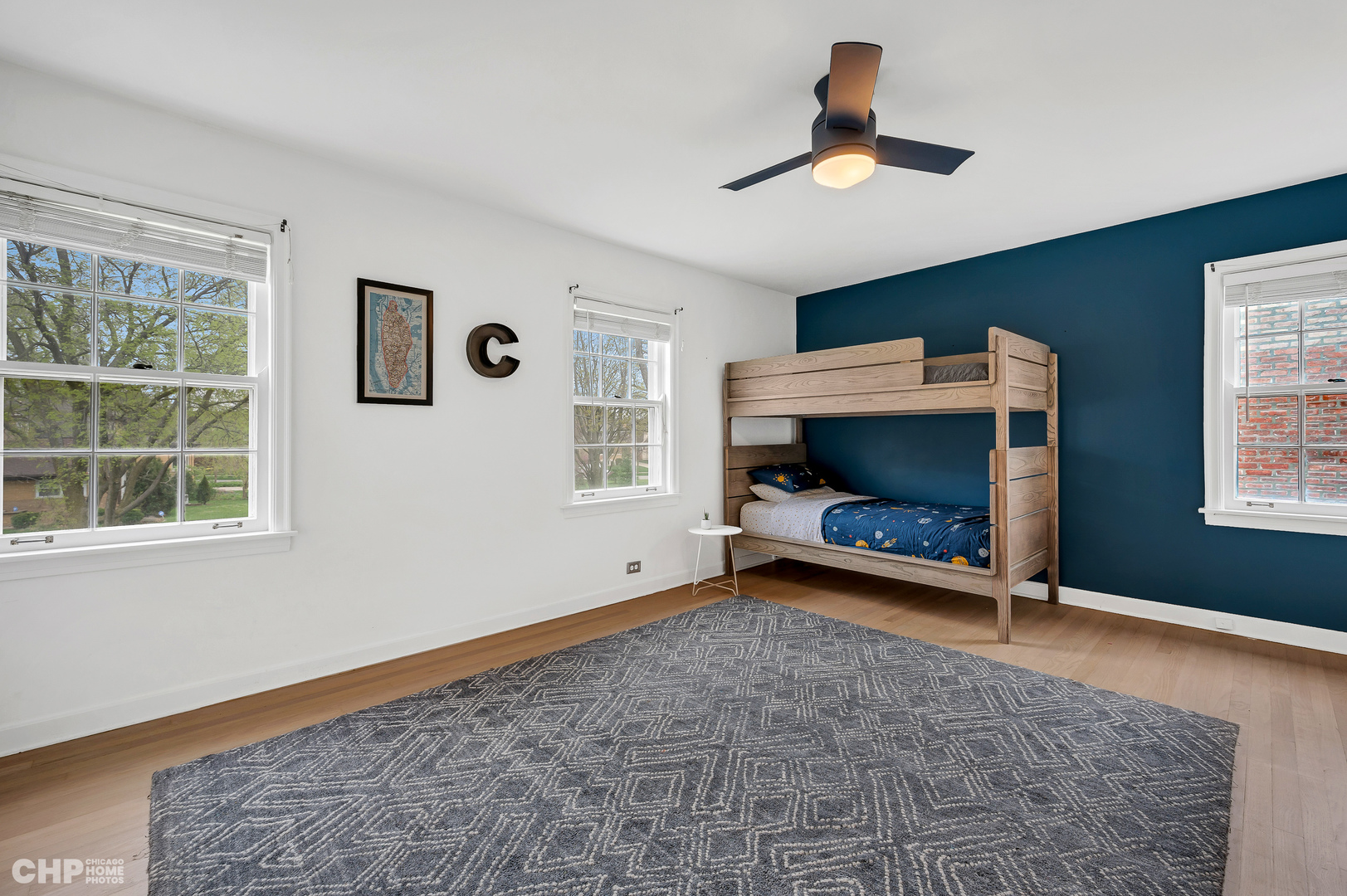 316 Nuttall Road Riverside, IL 60546 - Photo 22 of 40 a living room with a fireplace furniture a ceiling fan and a window