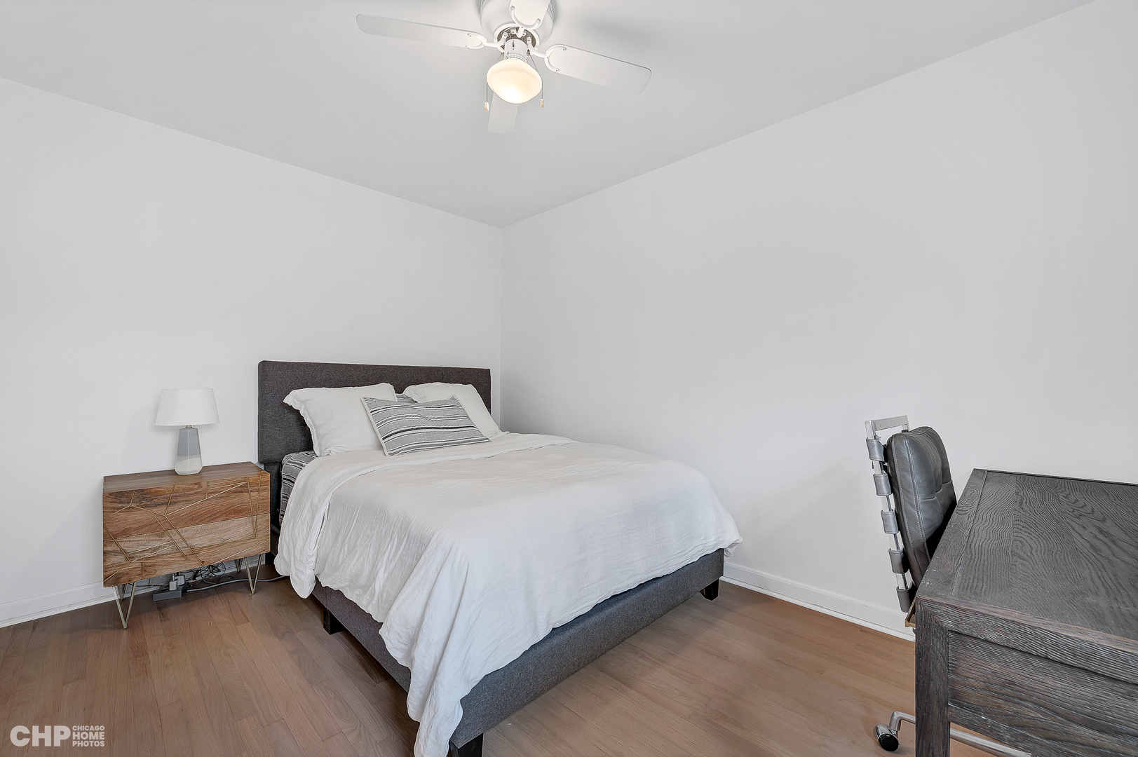 316 Nuttall Road Riverside, IL 60546 - Photo 23 of 40 a bedroom with a bed and a chair