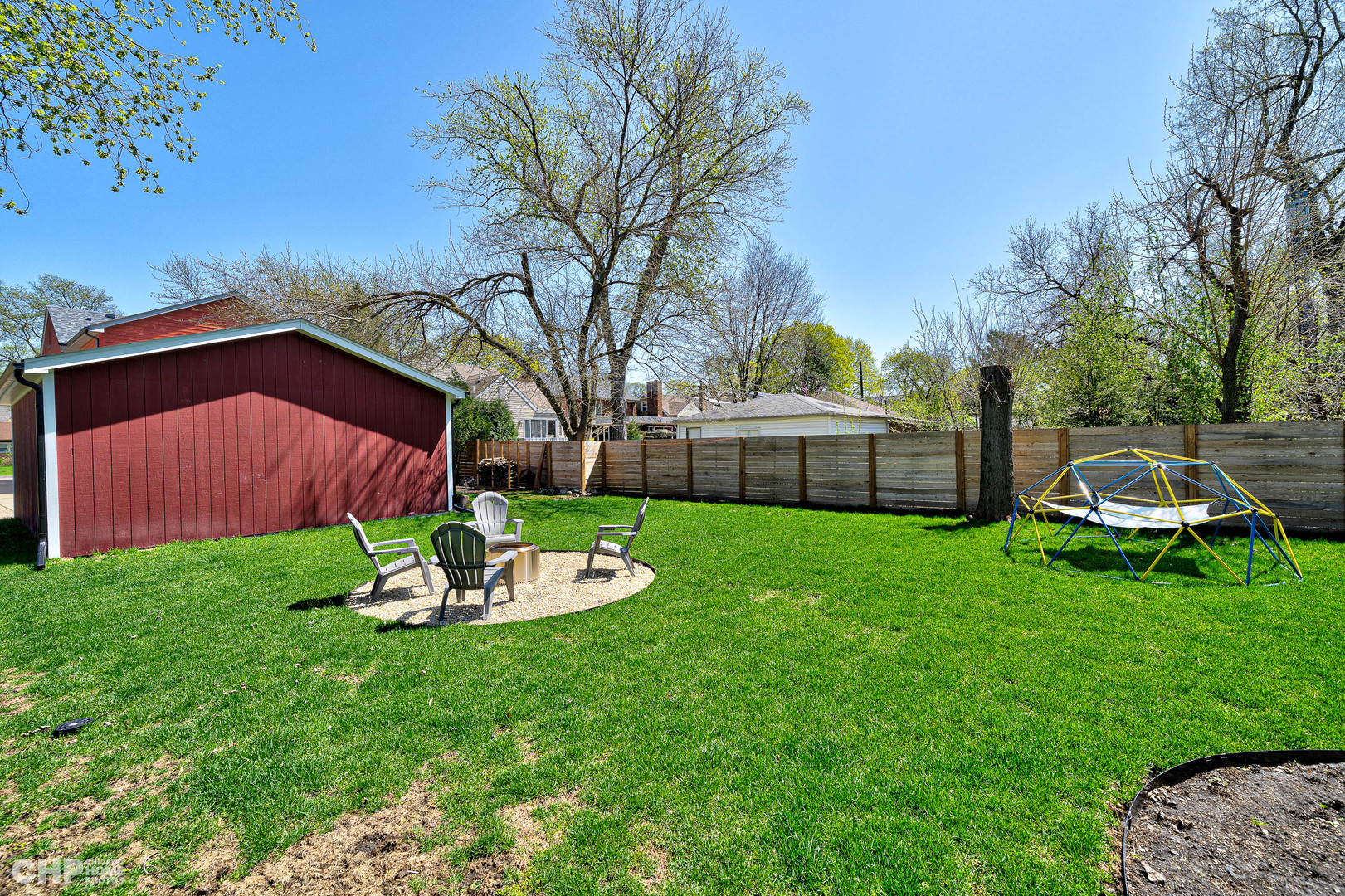 316 Nuttall Road Riverside, IL 60546 - Photo 35 of 40 a view of a backyard with table and chairs and a fire pit