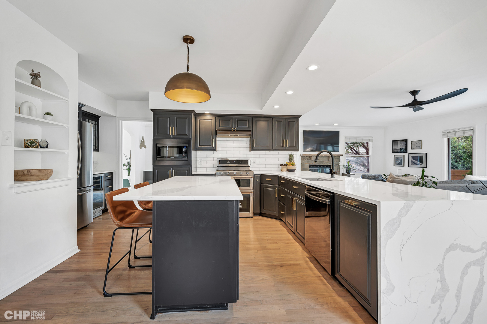 316 Nuttall Road Riverside, IL 60546 - Photo 7 of 40 a kitchen with stainless steel appliances granite countertop a refrigerator a sink dishwasher a dining table and chairs with wooden floor