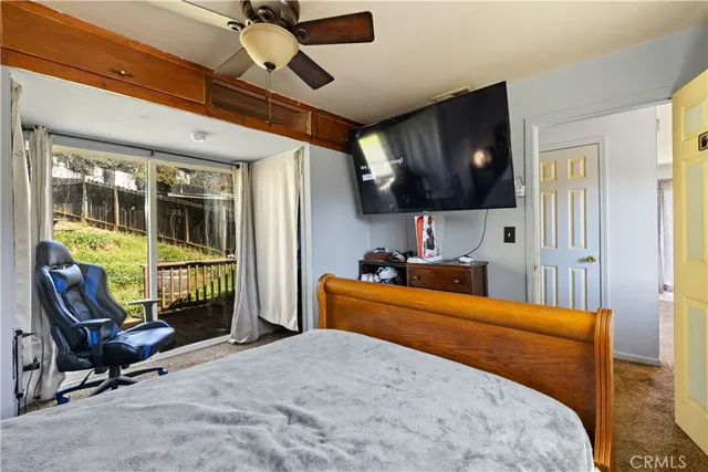 a bedroom with furniture and a window