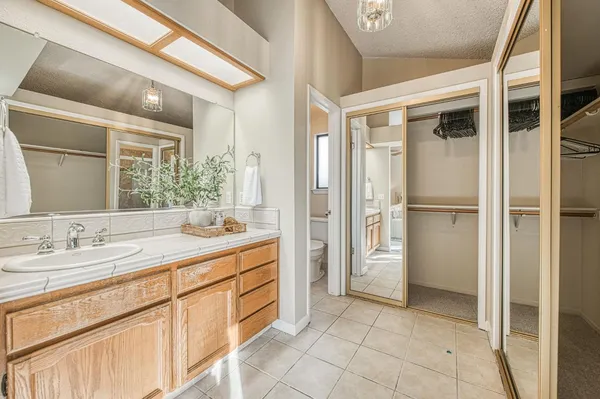 a spacious bathroom with a shower and a sink