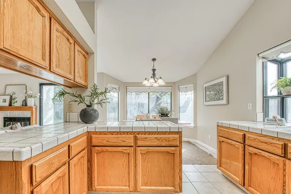 a kitchen with stainless steel appliances granite countertop a sink and cabinets
