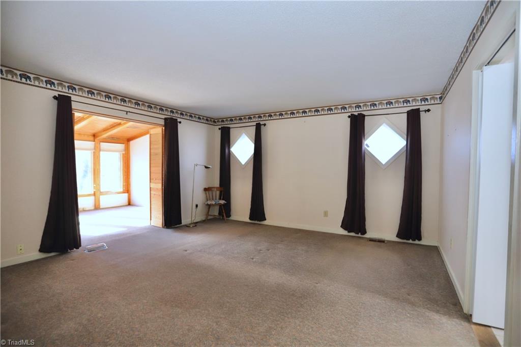 4611 East Perquimans Road Greensboro, NC 27407 - Photo 21 of 49 First floor primary bedroom