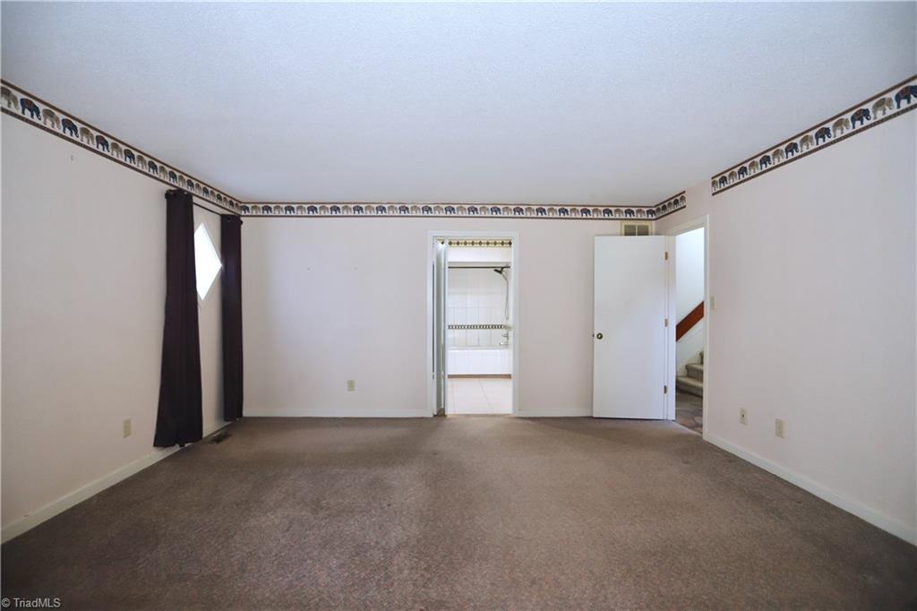 4611 East Perquimans Road Greensboro, NC 27407 - Photo 22 of 49 First floor primary bedroom