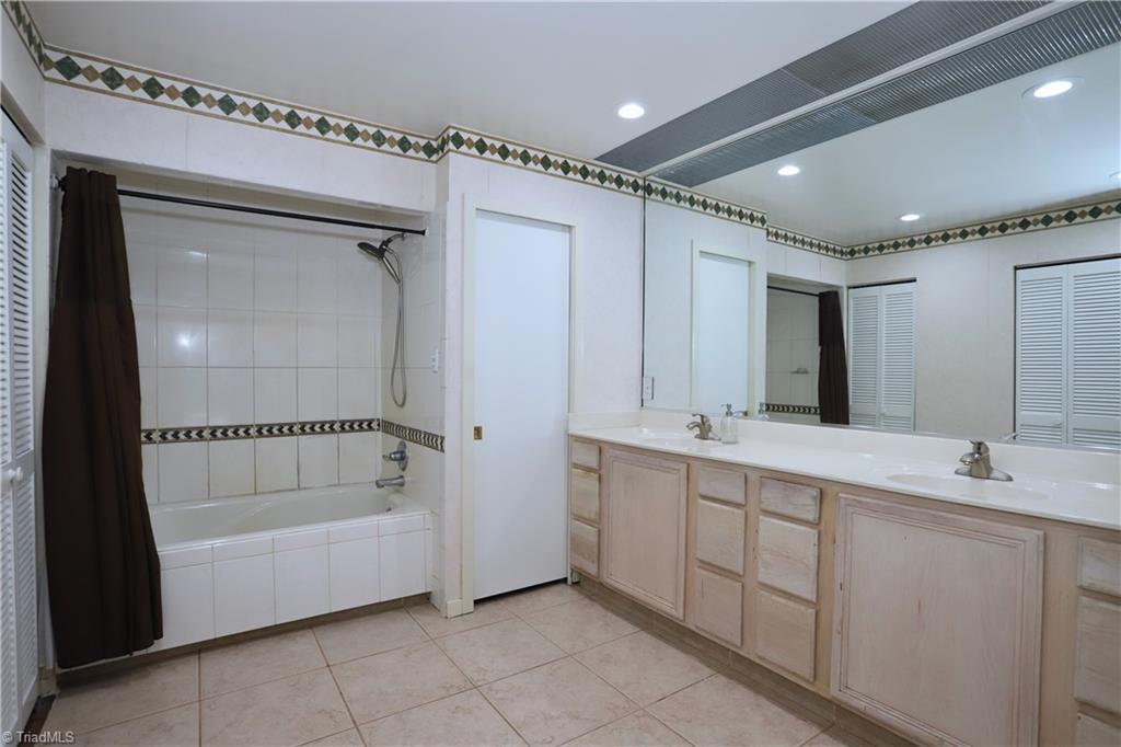 4611 East Perquimans Road Greensboro, NC 27407 - Photo 23 of 49 Primary ensuite bathroom