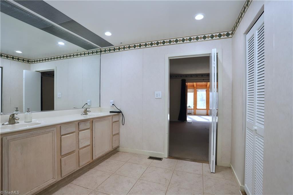 4611 East Perquimans Road Greensboro, NC 27407 - Photo 24 of 49 Primary ensuite bathroom