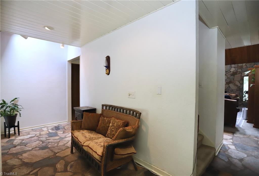 4611 East Perquimans Road Greensboro, NC 27407 - Photo 25 of 49 Stair access from front entrance hall to upper level