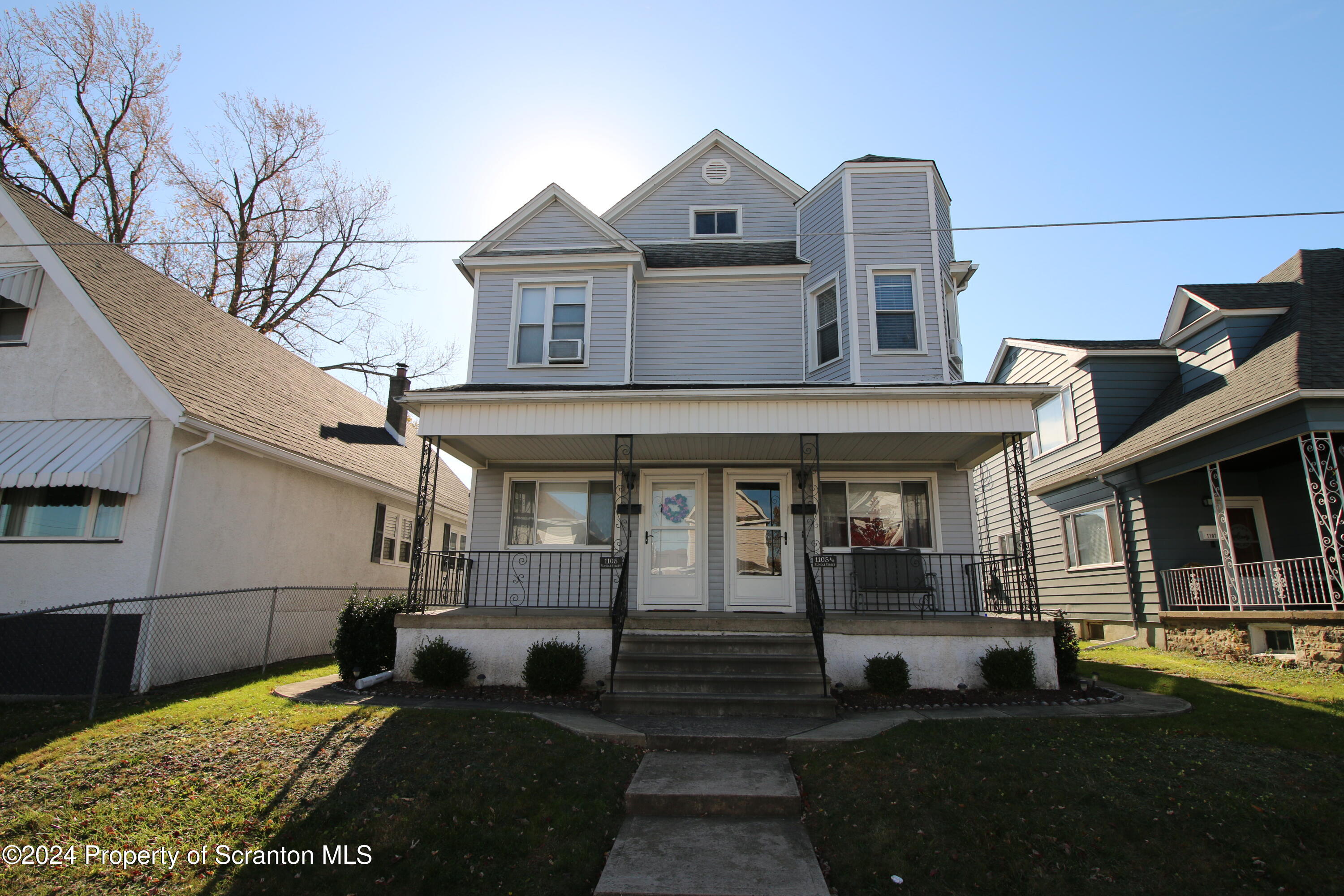 1105 Rundle Street Scranton, PA 18504 - Photo 1 of 30 a front view of a house with garden