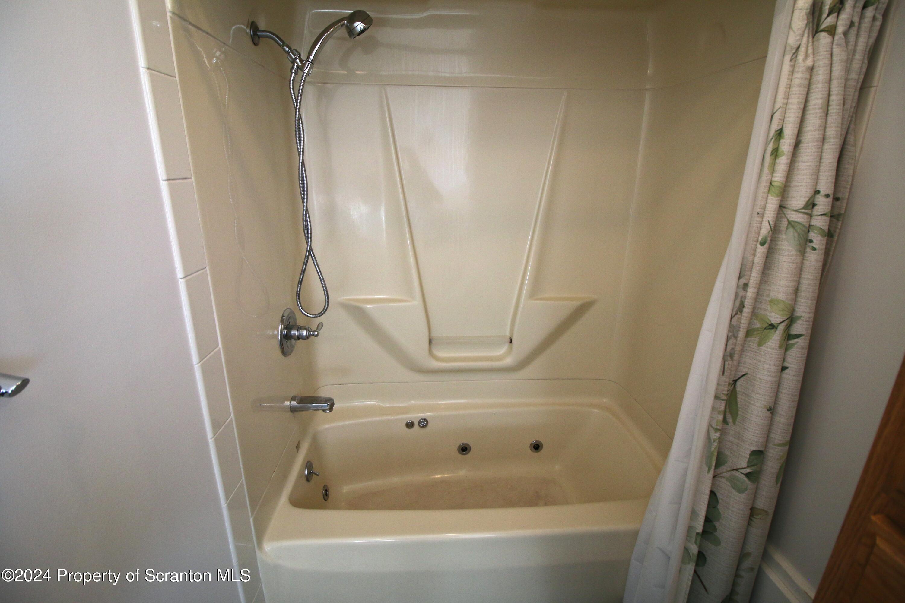 1105 Rundle Street Scranton, PA 18504 - Photo 14 of 30 a bathroom with a bathtub