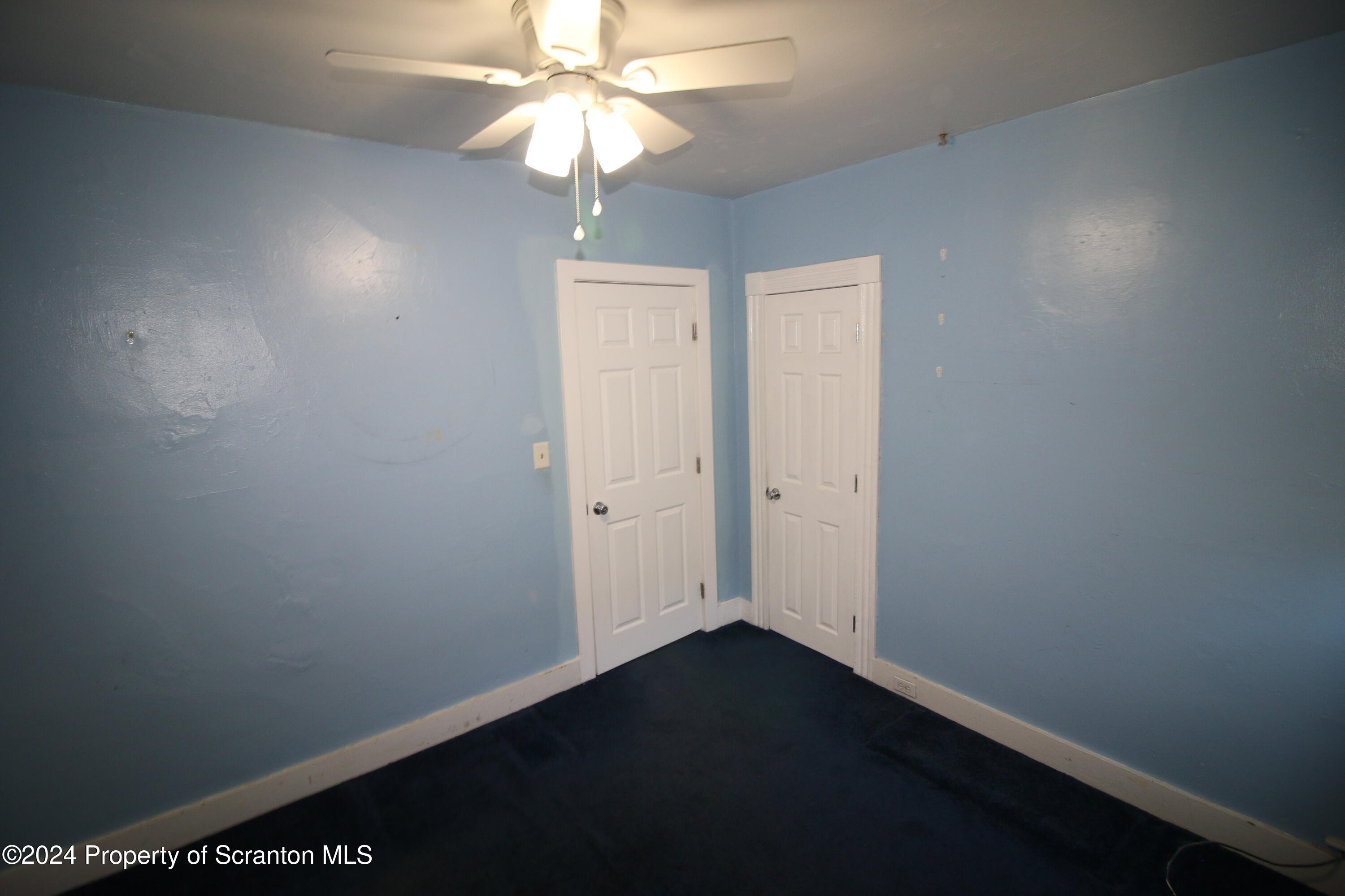 1105 Rundle Street Scranton, PA 18504 - Photo 16 of 30 an empty room with a ceiling fan and a window