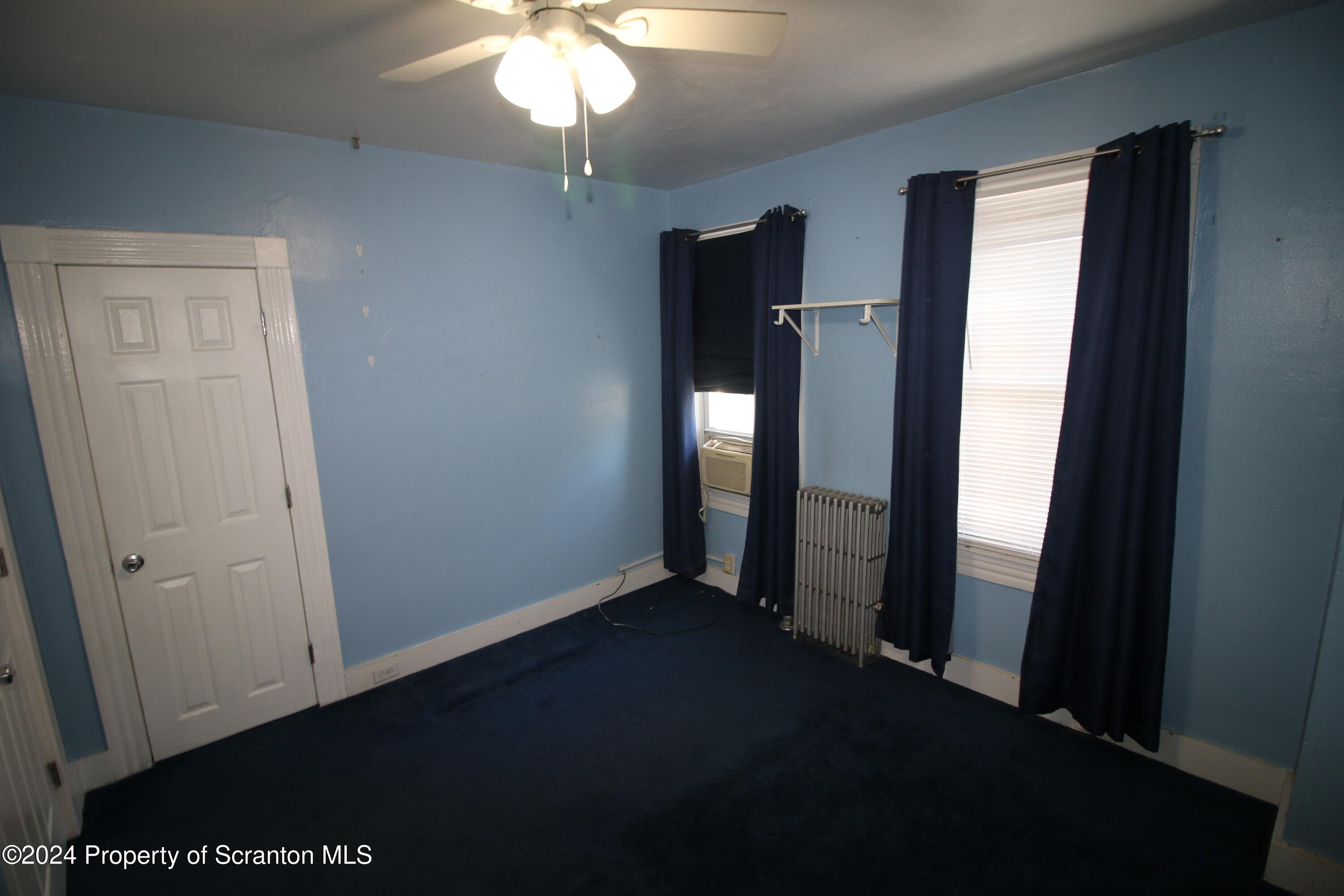 1105 Rundle Street Scranton, PA 18504 - Photo 18 of 30 wooden floor in an empty room with a window