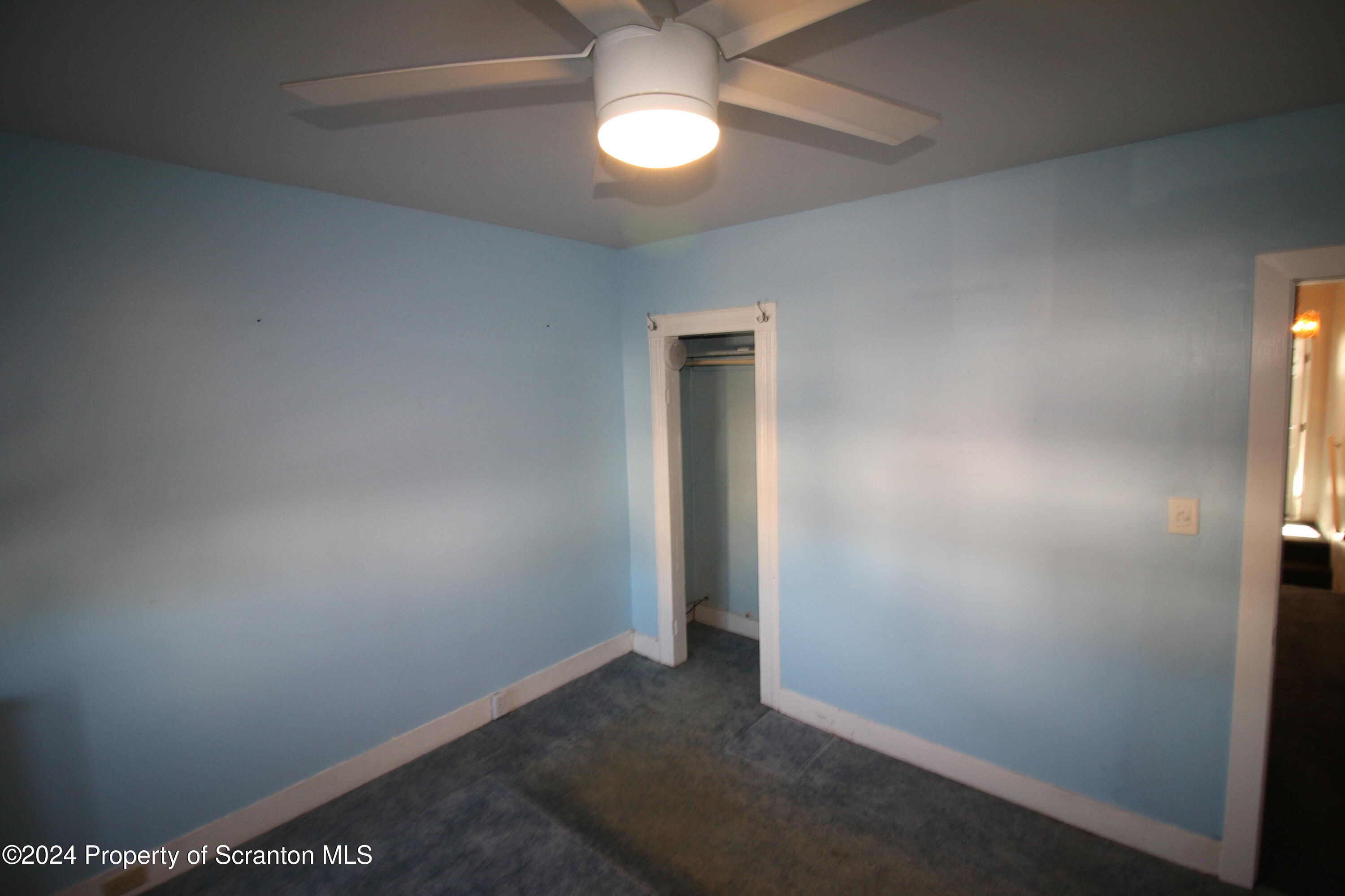 1105 Rundle Street Scranton, PA 18504 - Photo 19 of 30 an empty room with a ceiling fan and a window