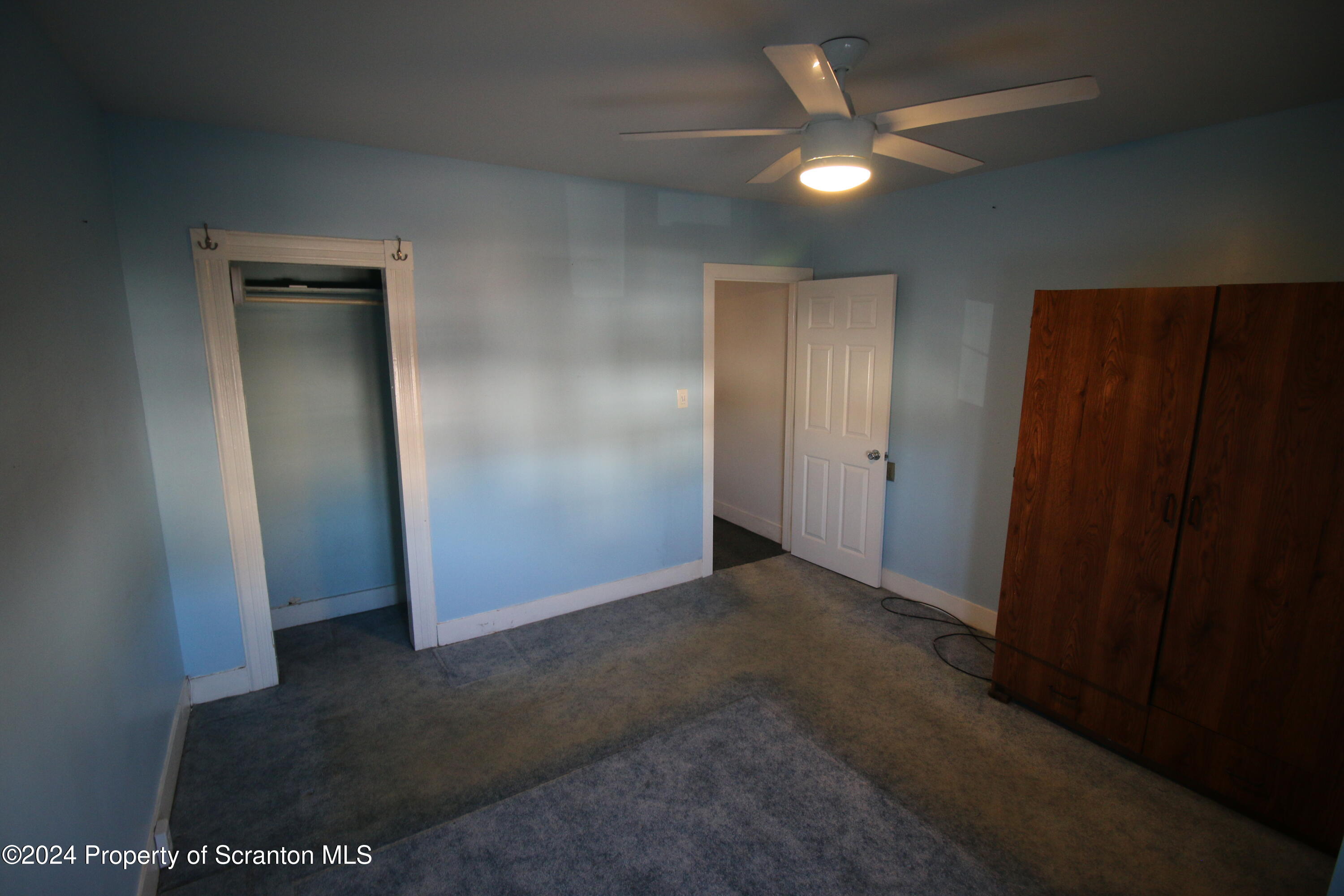 1105 Rundle Street Scranton, PA 18504 - Photo 20 of 30 an empty room with closet and a ceiling fan