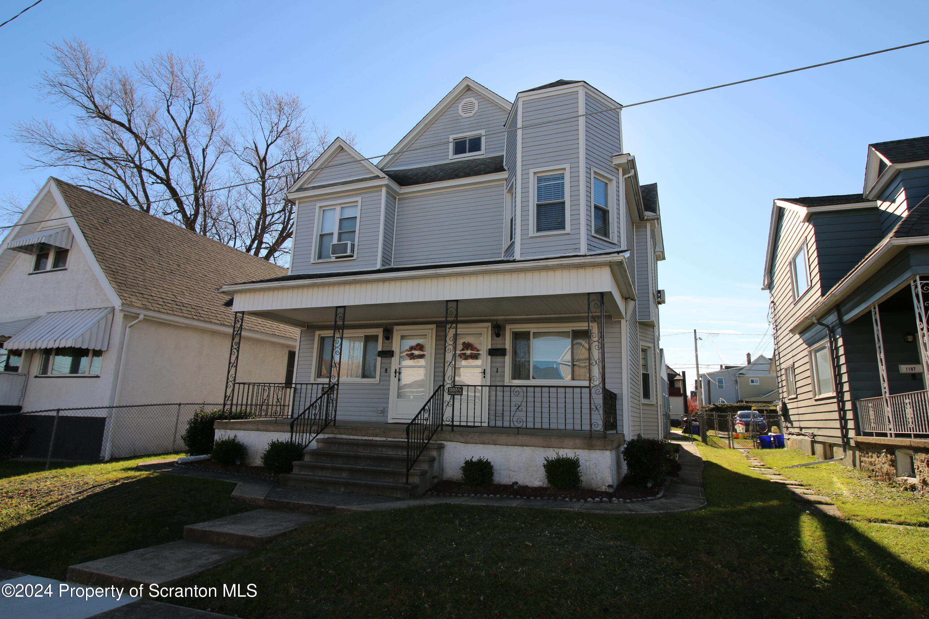 1105 Rundle Street Scranton, PA 18504 - Photo 2 of 30 a front view of a house with a yard