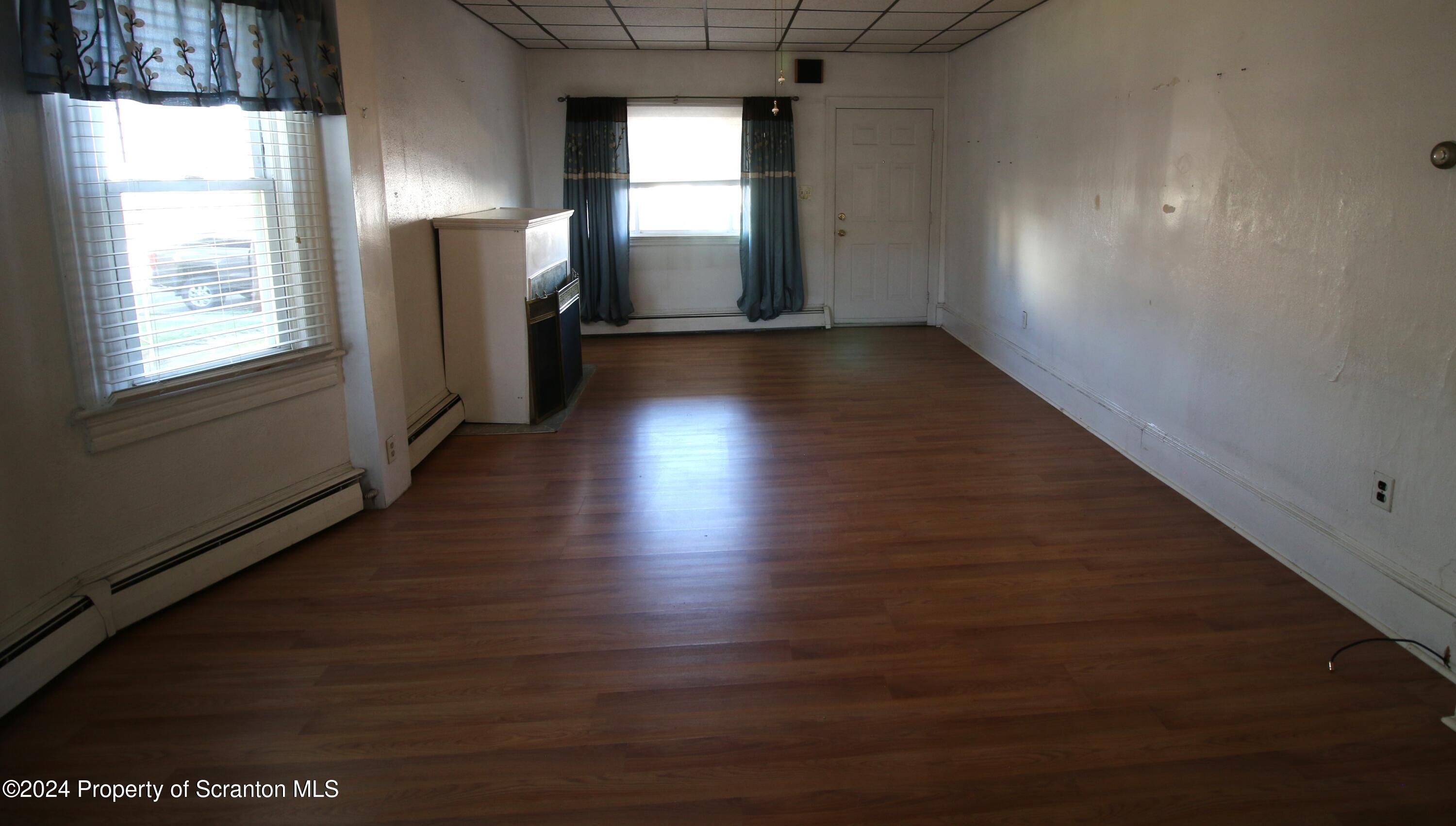 1105 Rundle Street Scranton, PA 18504 - Photo 24 of 30 an empty room with wooden floor and windows