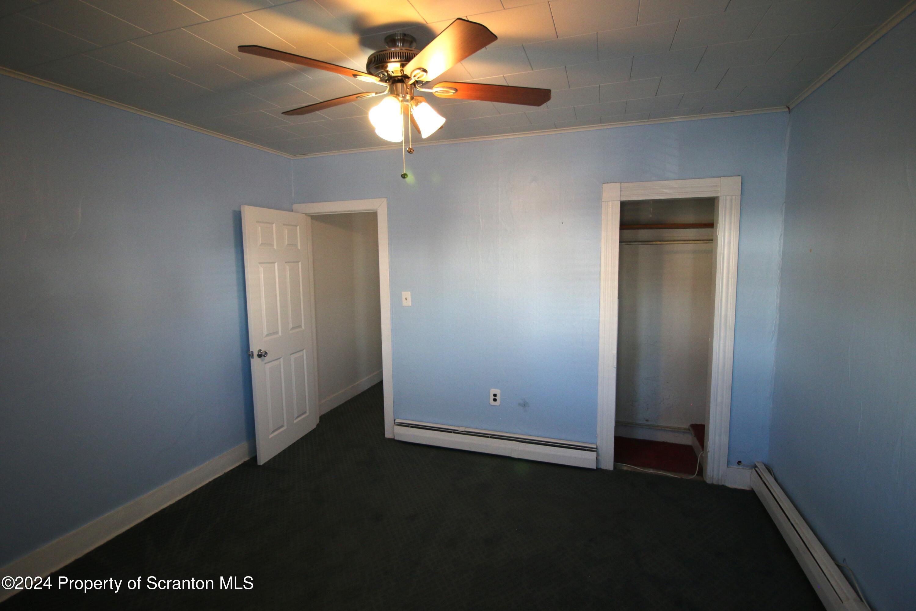 1105 Rundle Street Scranton, PA 18504 - Photo 25 of 30 an empty room with a fan and a ceiling fan