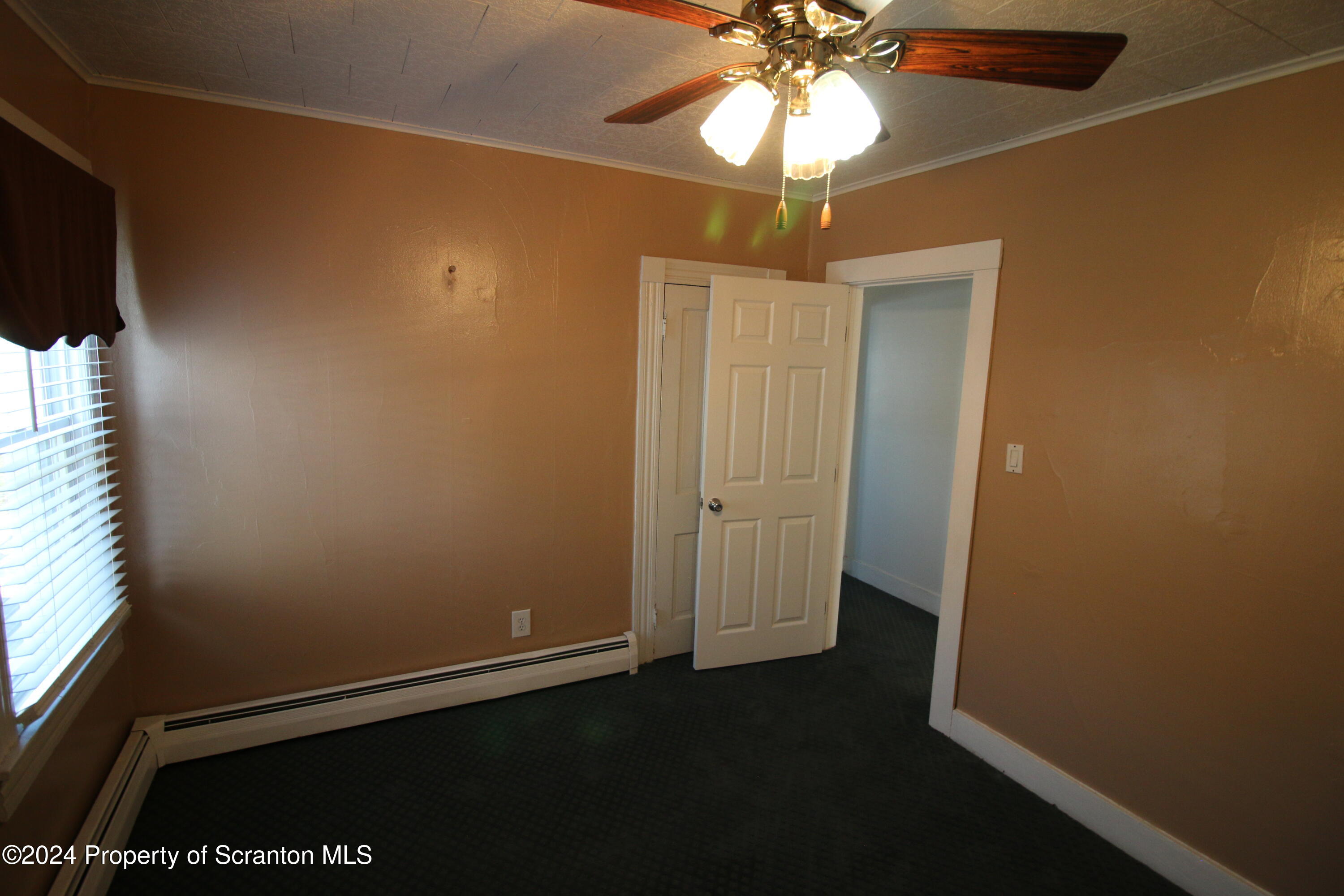1105 Rundle Street Scranton, PA 18504 - Photo 26 of 30 an empty room with wooden floor fan and window