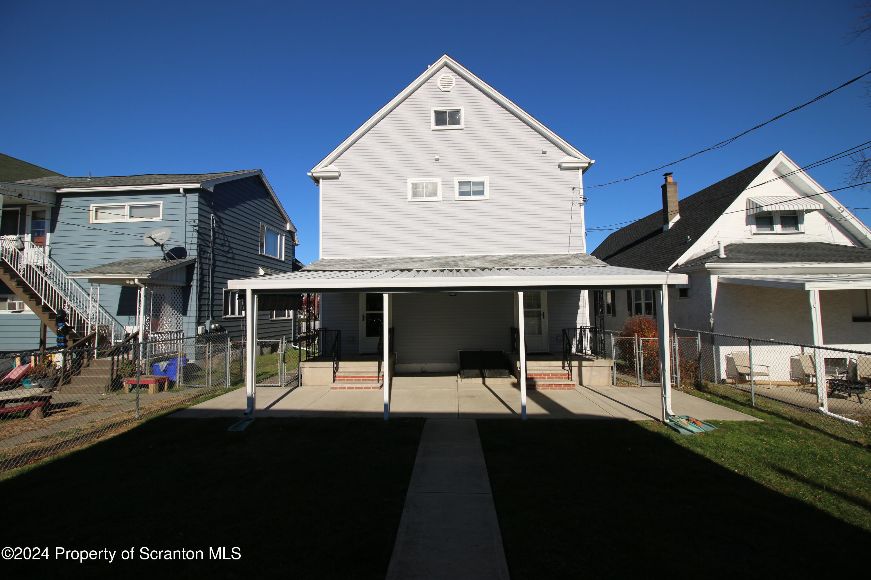 1105 Rundle Street Scranton, PA 18504 - Photo 3 of 30 a view of a house with floor to ceiling windows and a table