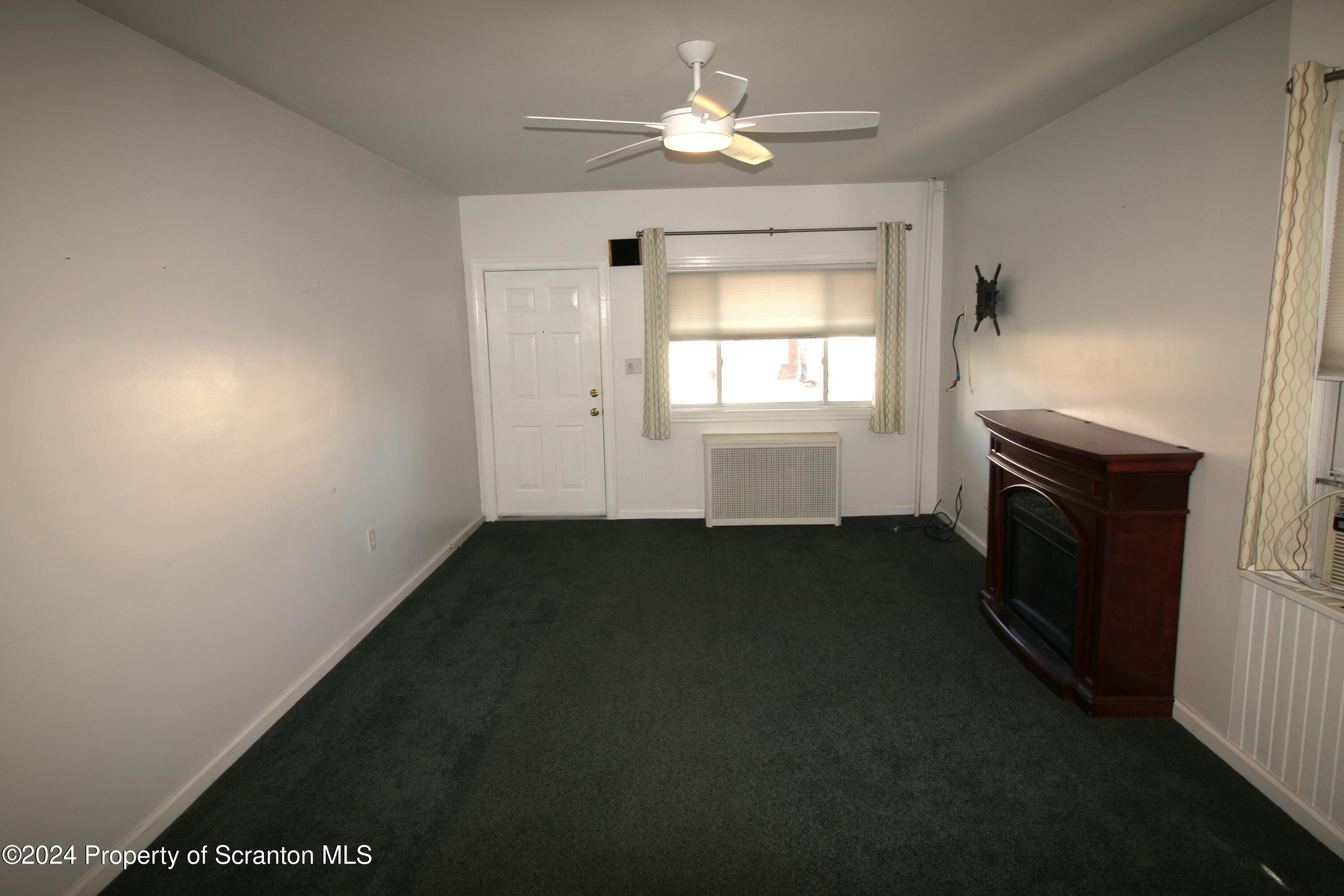 1105 Rundle Street Scranton, PA 18504 - Photo 7 of 30 a view of empty room with a fireplace