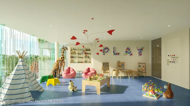 a lobby with a couch and a rug