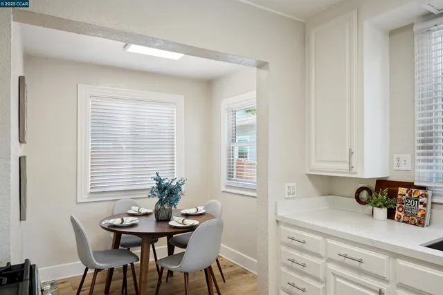 a view of a dining room with furniture and window