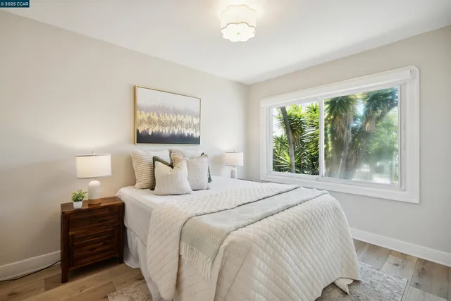 a bedroom with bed and a window