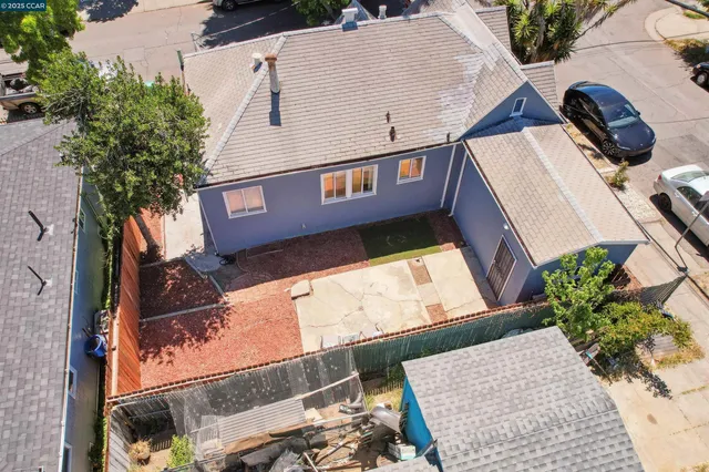 aerial view of a house with a yard