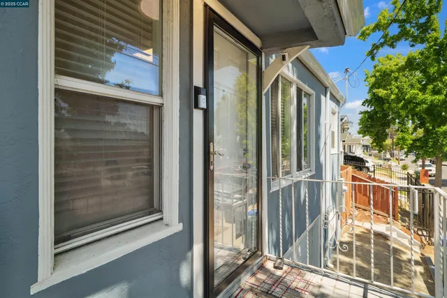 a view of a brick house with a glass door