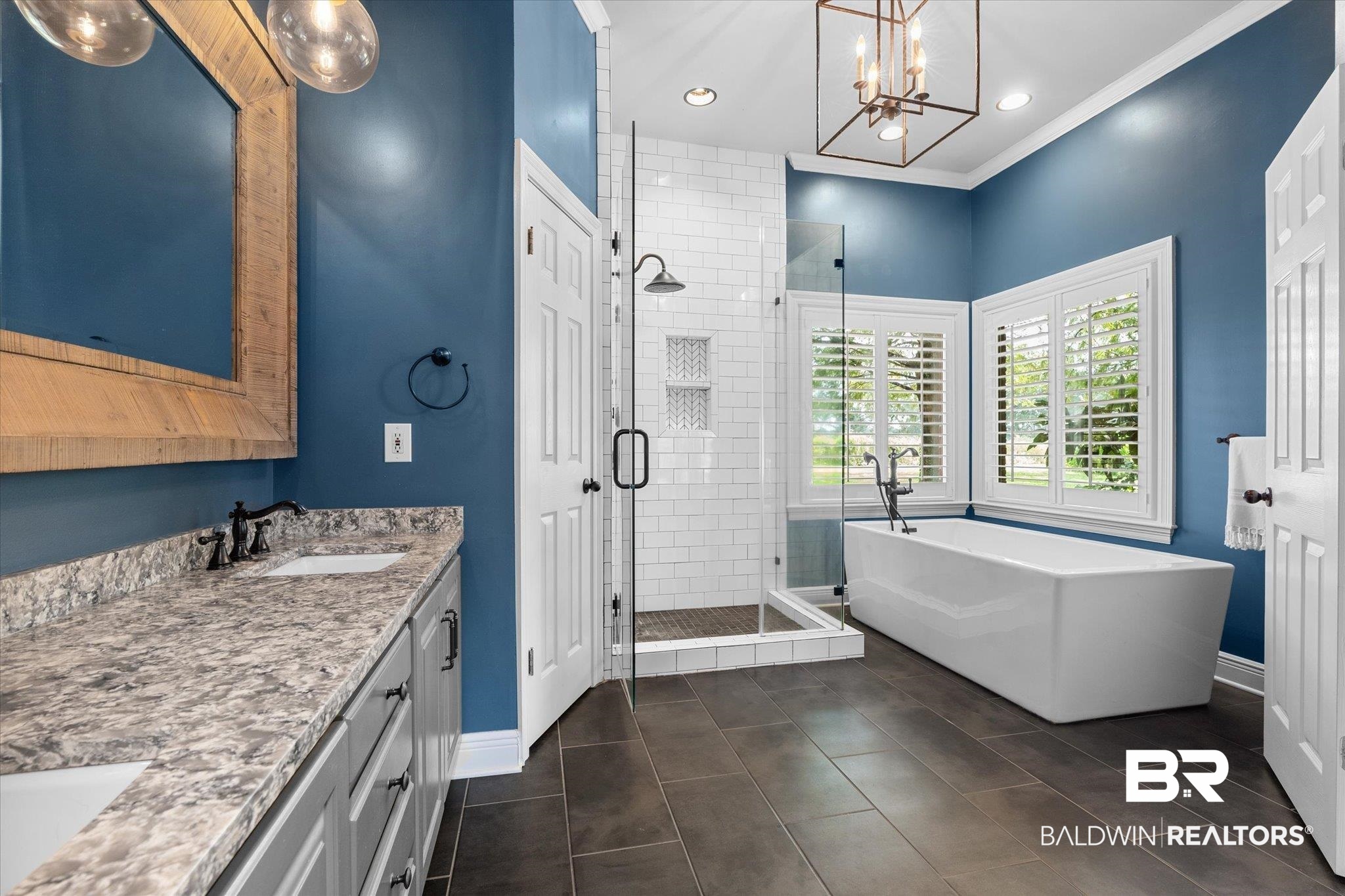 5231 Dawes Road Grand Bay, AL 36541 - Photo 17 of 49 Bathroom featuring vanity, an inviting chandelier, separate shower and tub, ornamental molding, and tile patterned floors