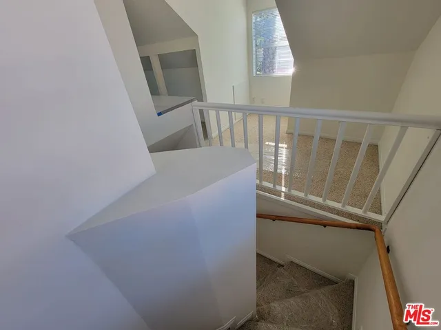 a view of balcony with wooden floor