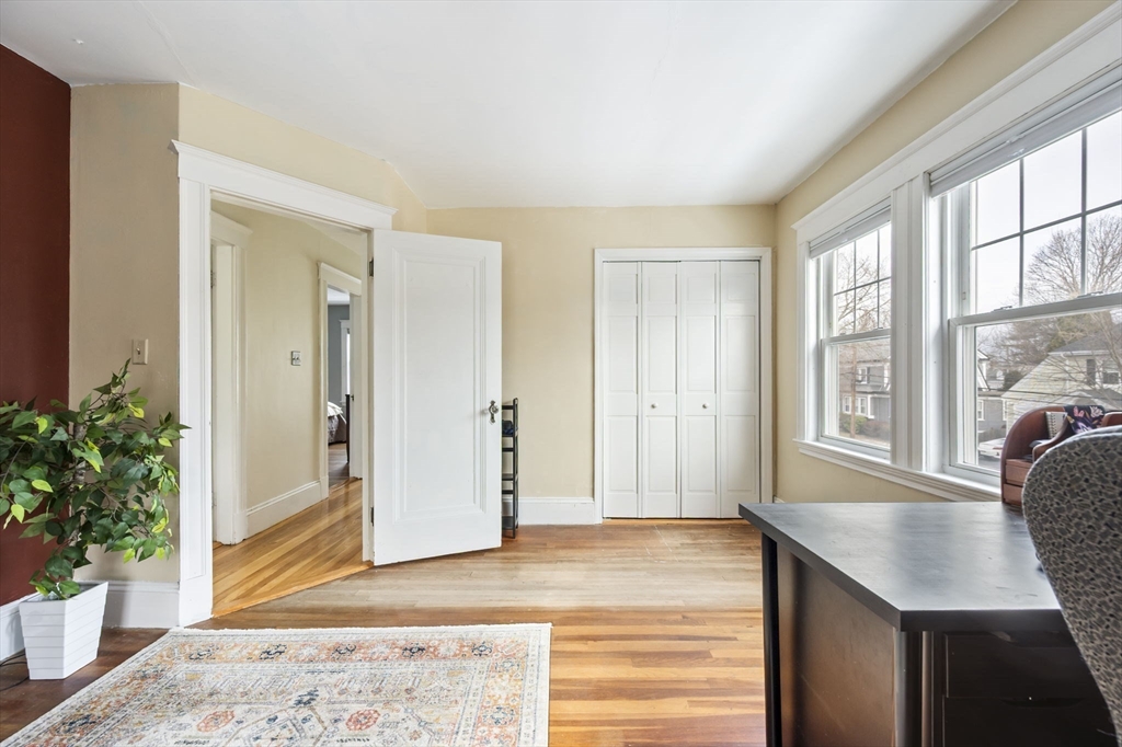 71 Governors Road Milton, MA 02186 - Photo 21 of 25 a view of a hallway with furniture and window
