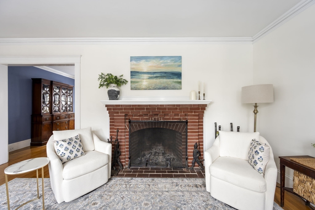 71 Governors Road Milton, MA 02186 - Photo 5 of 25 a living room with furniture and a fireplace