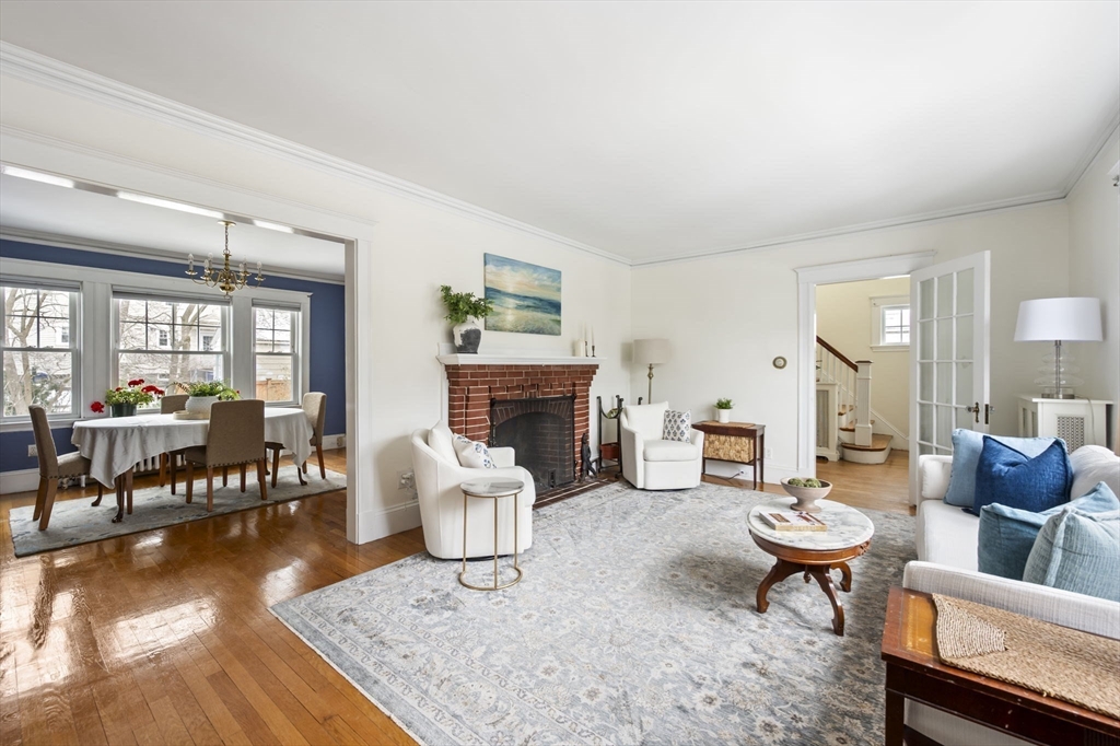 71 Governors Road Milton, MA 02186 - Photo 6 of 25 a living room with furniture and a fireplace