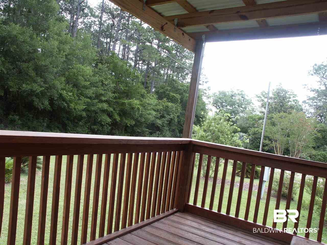 1364 Caney Loop Lillian, AL 36549 - Photo 22 of 26 Front Yard Deck