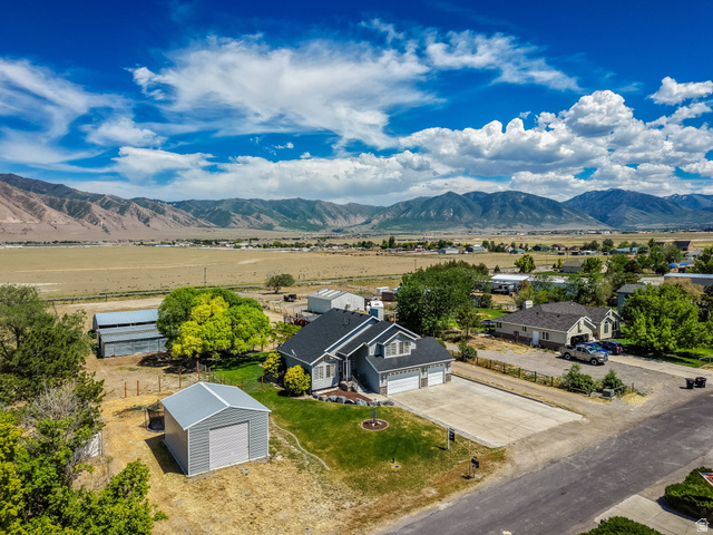 3732 Campbell Road Tooele, UT 84074 - Photo 45 of 69 Two-story residence featuring a dark gray roof, light gray siding, and an attached two-car garage