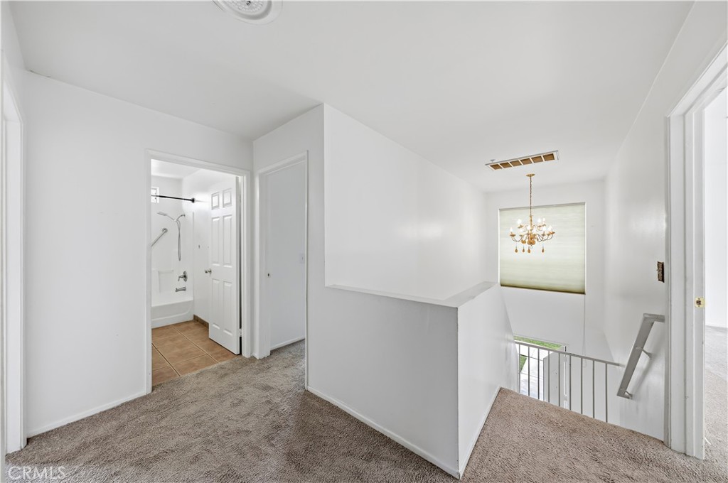 8317 College Avenue Whittier, CA 90605 - Photo 18 of 41 a view of a hallway with closet area