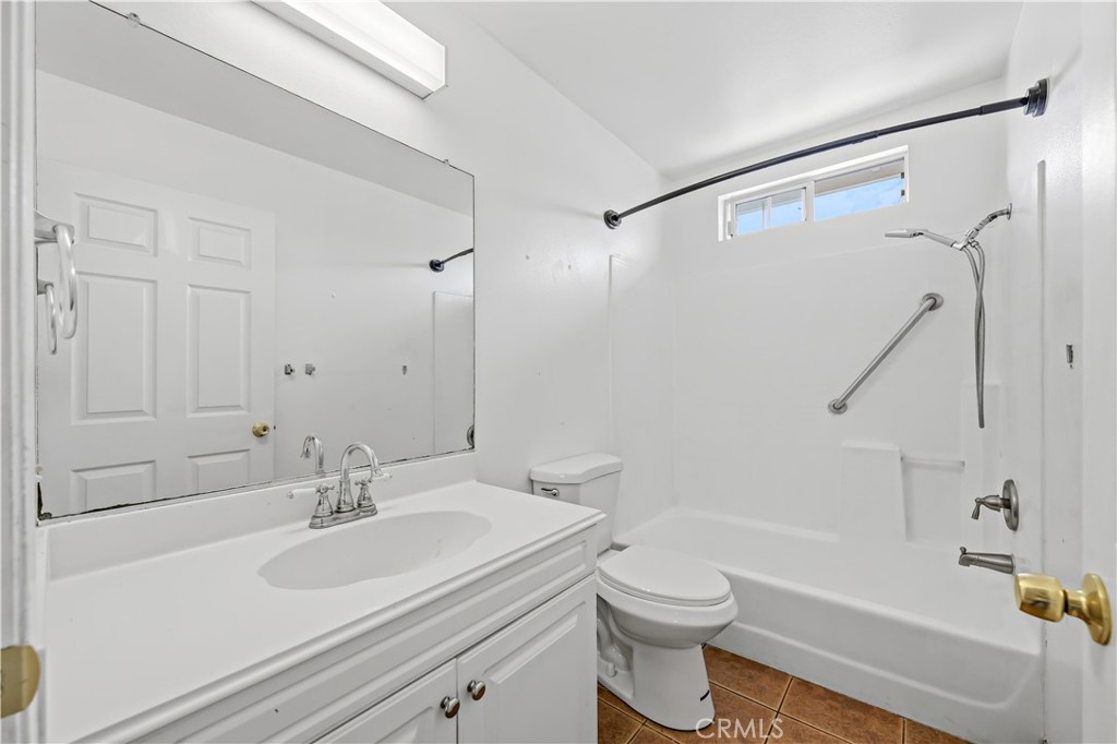 8317 College Avenue Whittier, CA 90605 - Photo 29 of 41 a bathroom with a sink toilet and shower