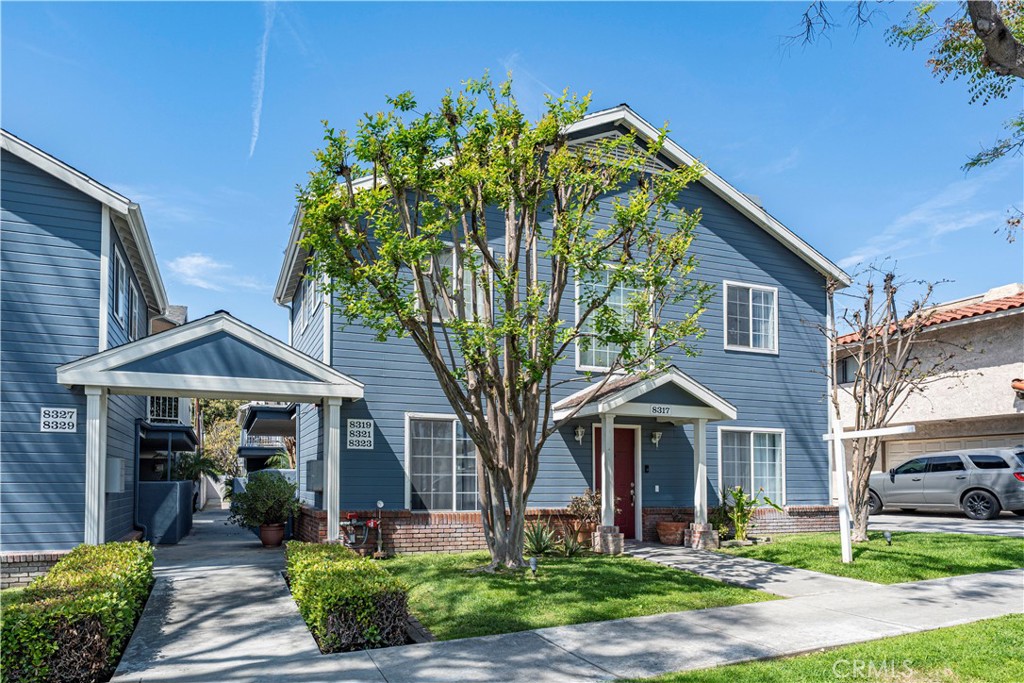 8317 College Avenue Whittier, CA 90605 - Photo 3 of 41 a front view of a house with garden
