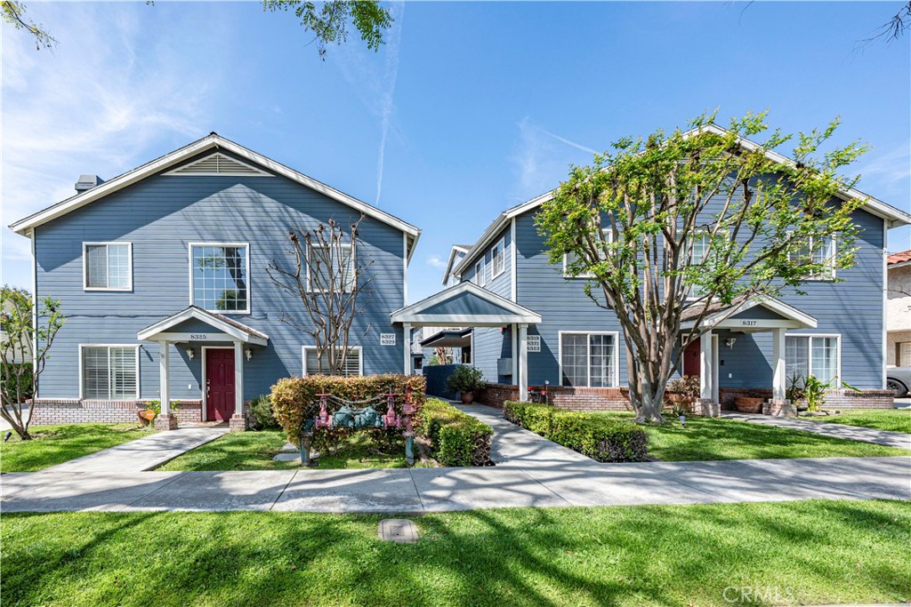 8317 College Avenue Whittier, CA 90605 - Photo 32 of 41 a front view of a house with a garden