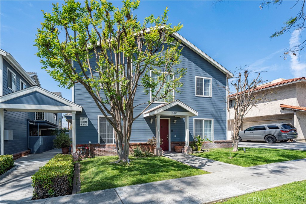8317 College Avenue Whittier, CA 90605 - Photo 6 of 41 a front view of a house with a yard