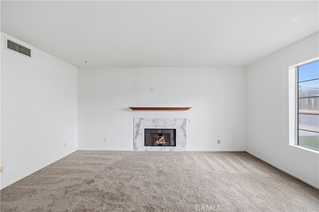 8317 College Avenue Whittier, CA 90605 - Photo 7 of 41 a view of empty room with a fireplace