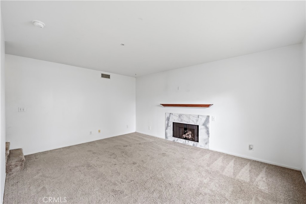 8317 College Avenue Whittier, CA 90605 - Photo 8 of 41 a view of empty room with a fireplace