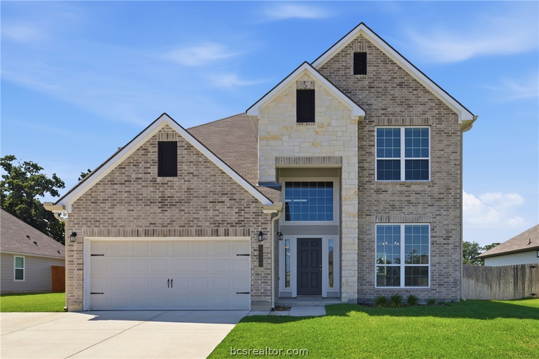 1922 Viva Road Bryan, TX 77807 - Photo 1 of 45 Enhanced curb appeal with an extended apron pour for third-car parking and a wide frontage easement creating extra privacy and quiet, peaceful setback from the road.