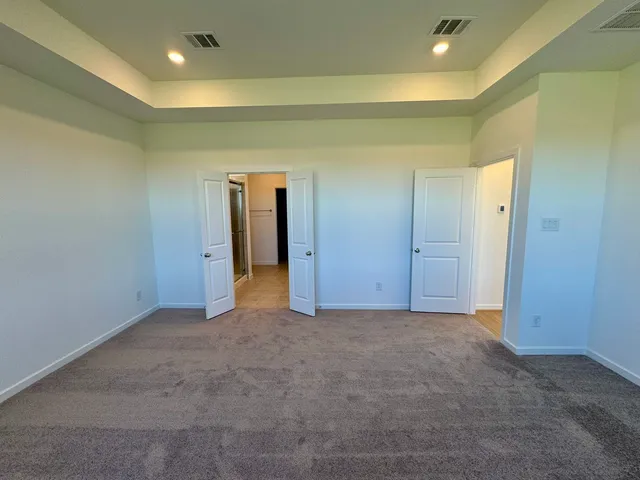 an empty room and closet area