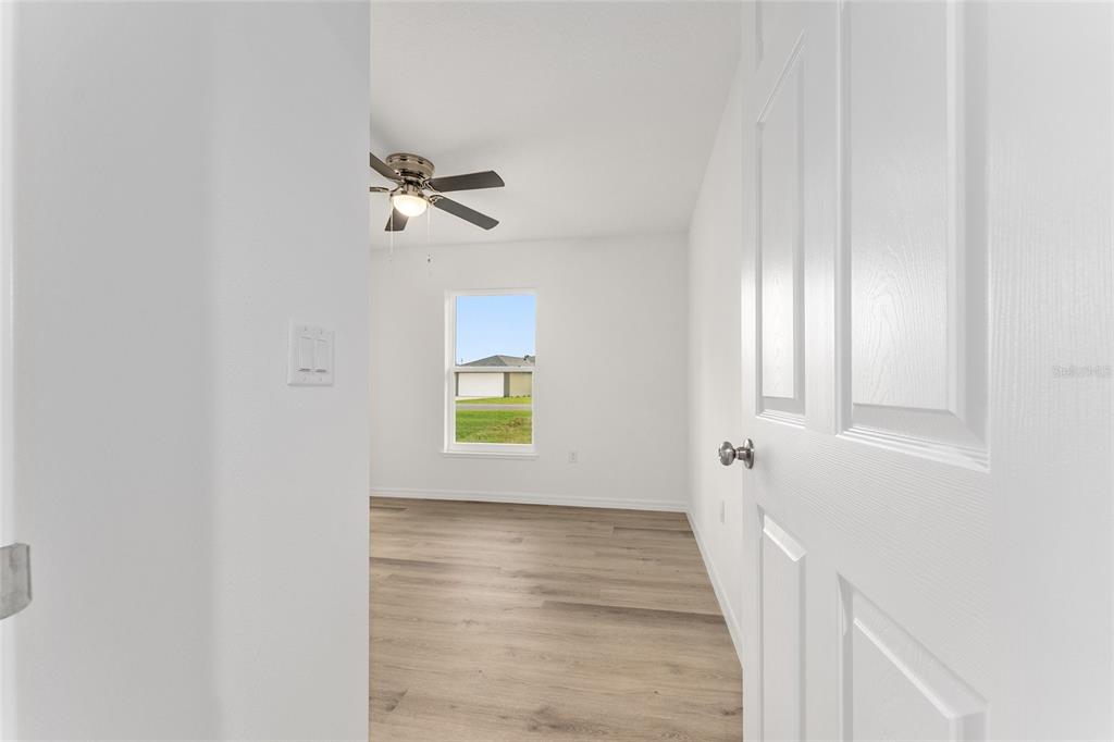 13119 Northeast 7th Loop Silver Springs, FL 34488 - Photo 30 of 51 a view of a hallway with windows