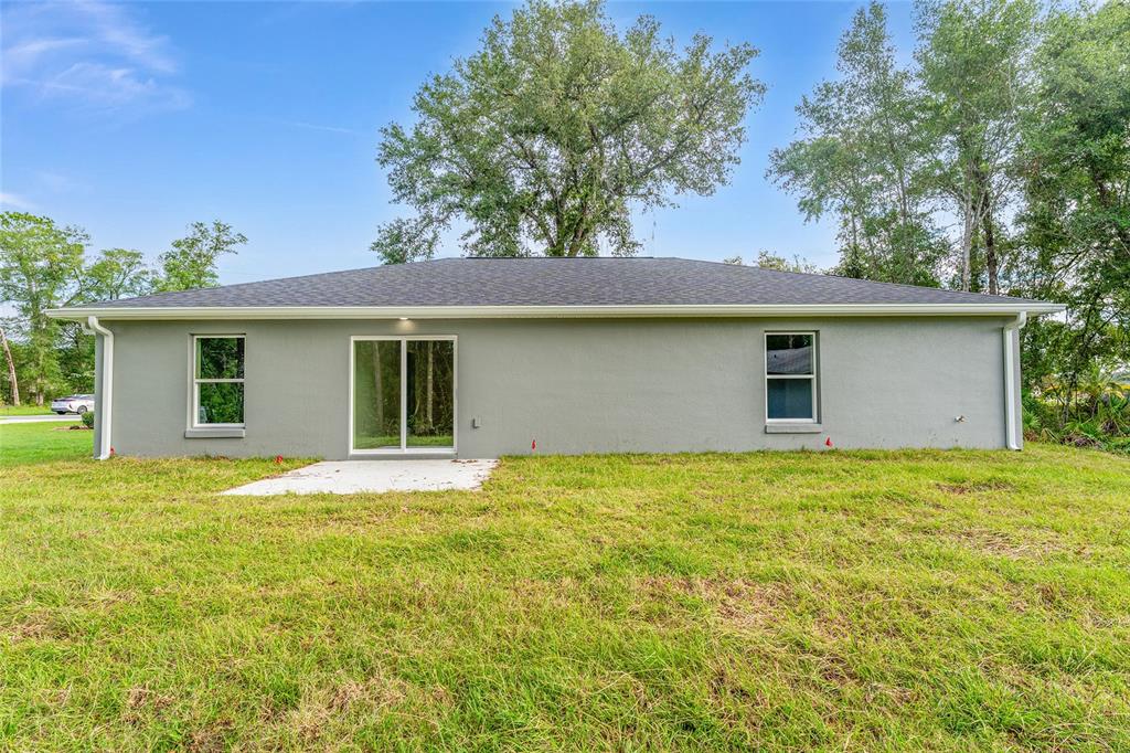 13119 Northeast 7th Loop Silver Springs, FL 34488 - Photo 47 of 51 a house view with a garden space