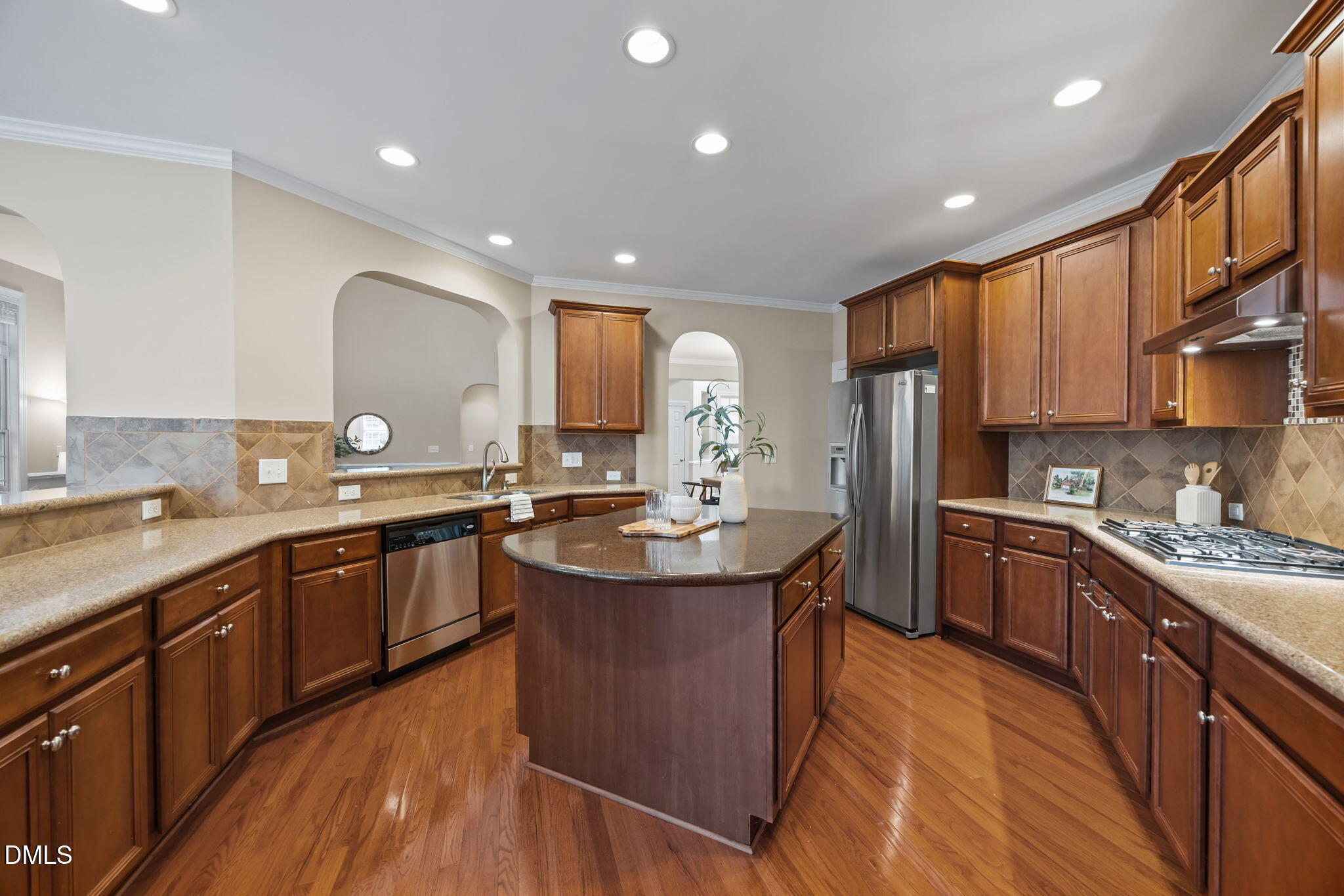 5309 Lyon Farm Drive Durham, NC 27713 - Photo 10 of 68 a large kitchen with stainless steel appliances granite countertop a sink a stove and a refrigerator