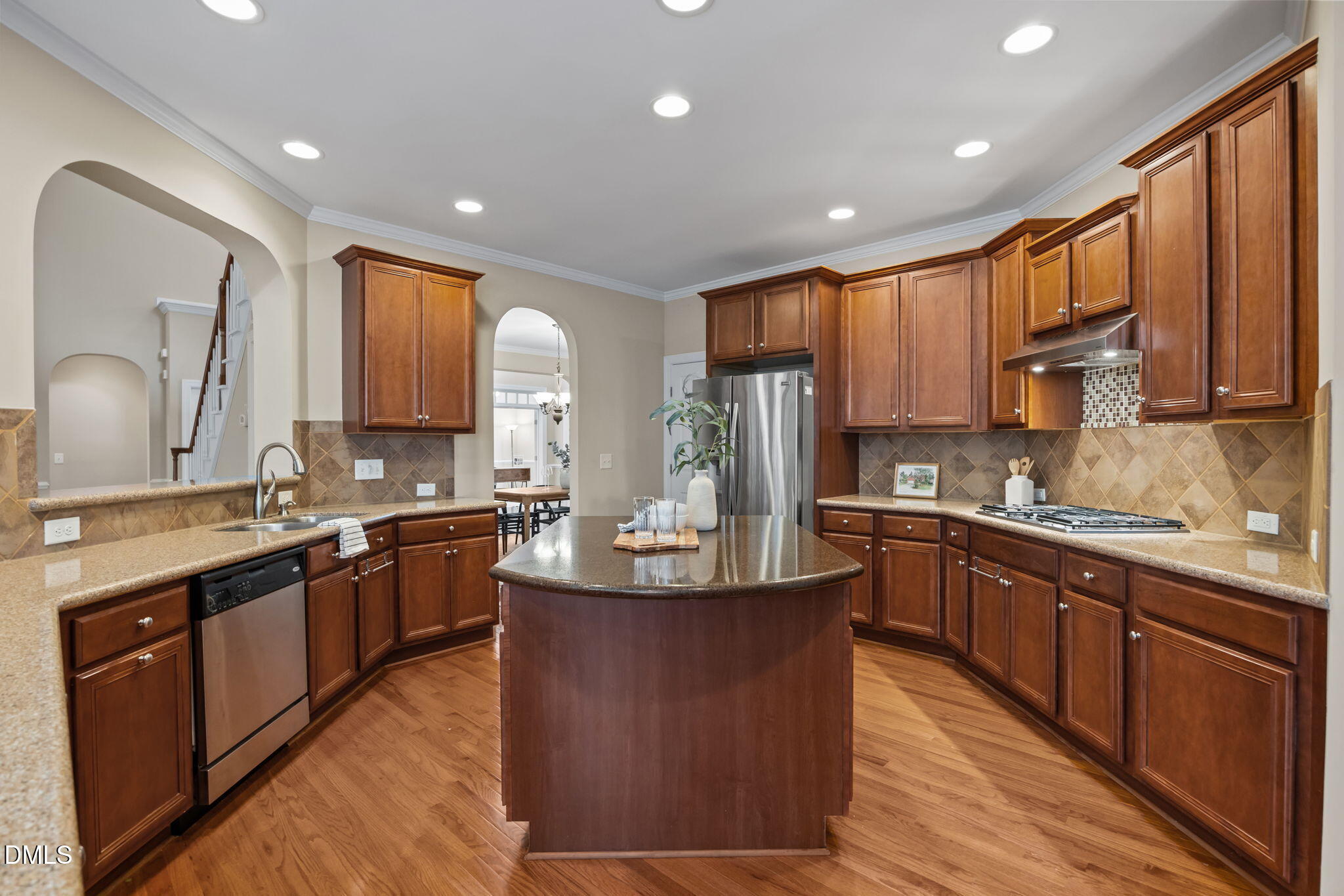 5309 Lyon Farm Drive Durham, NC 27713 - Photo 13 of 68 a large kitchen with stainless steel appliances granite countertop a stove a sink dishwasher a refrigerator and a oven