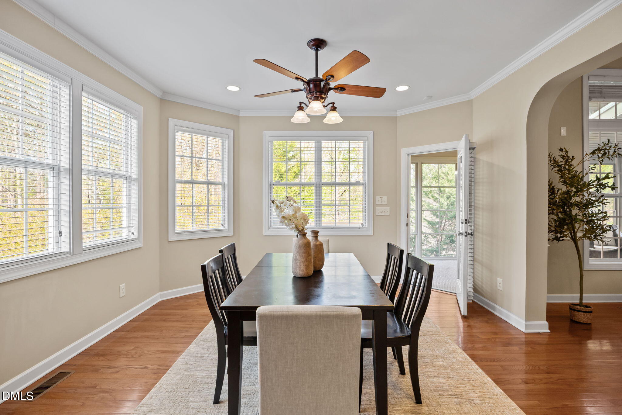 5309 Lyon Farm Drive Durham, NC 27713 - Photo 14 of 68 a view of a dining room with furniture window and wooden floor